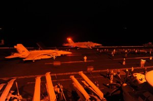 U.S. jet fighters prepare to launch from the aircraft carrier USS George H.W. Bush in the Arabian Sea to conduct strike missions against Islamic State targets, September 2014.
