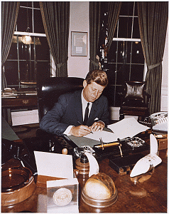 President Kennedy signing the Cuba Quarantine Proclamation in 1962.